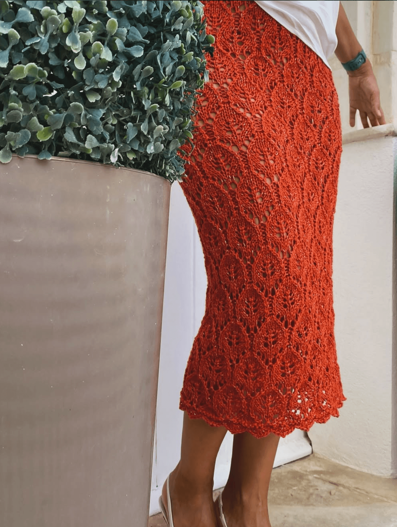 Olja wearing handknitted blue dress on Malta stone steps
